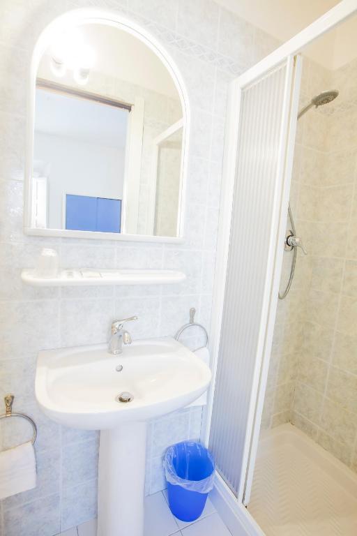 Koupelna v ubytování Hotel Rex