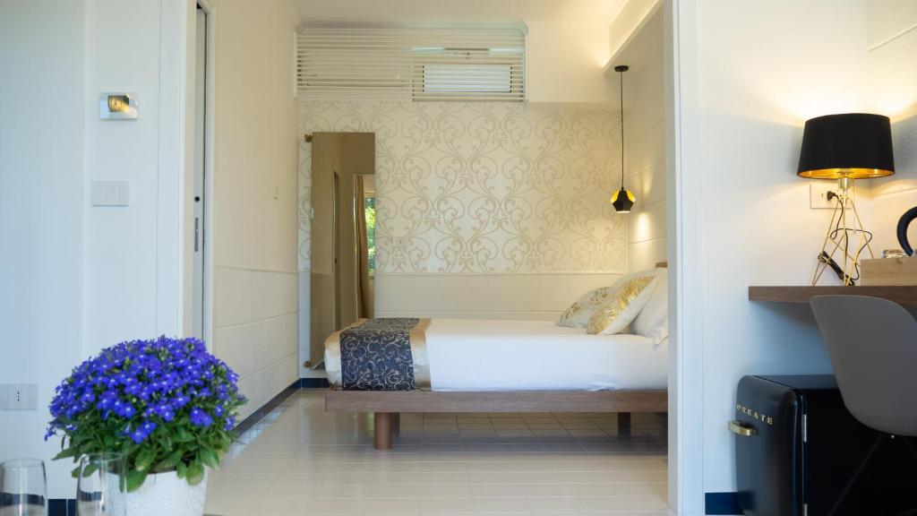 Letto o letti in una camera di Resort & Winery Bosco De Medici