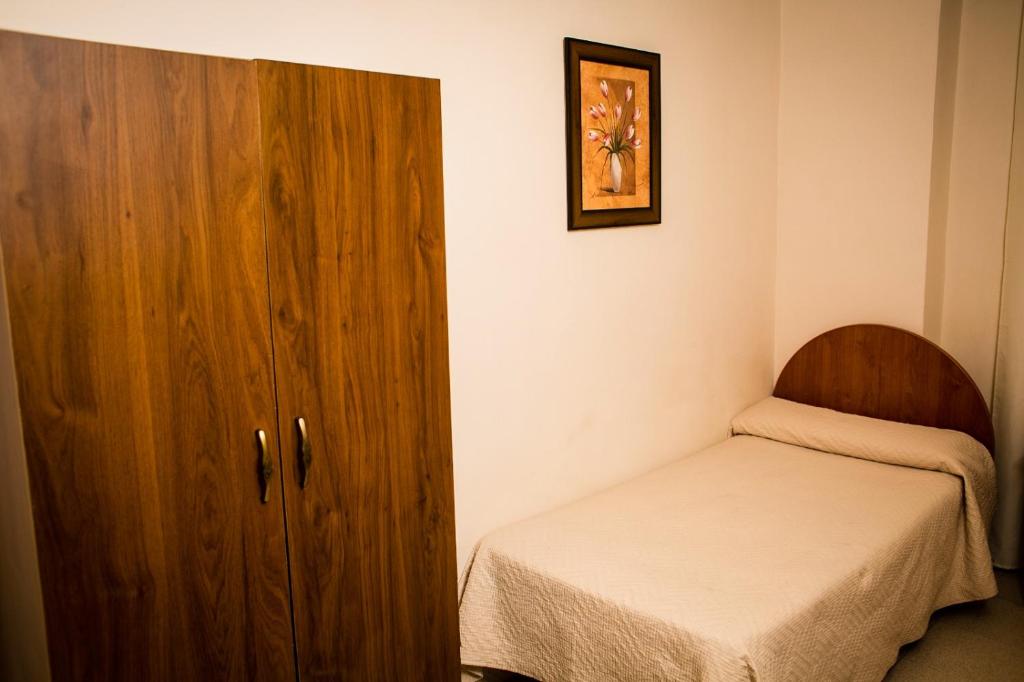 Posteľ alebo postele v izbe v ubytovaní Hostal Restaurante El Paso