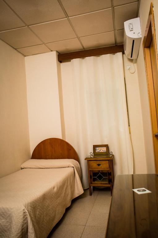 Posteľ alebo postele v izbe v ubytovaní Hostal Restaurante El Paso