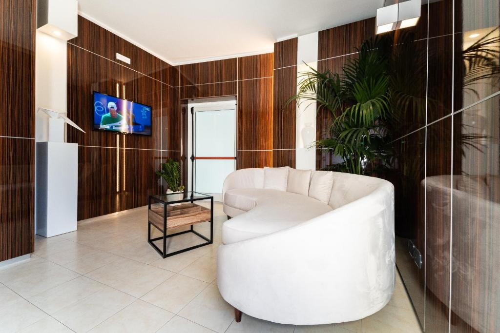 TV a/nebo společenská místnost v ubytování Hotel Falli