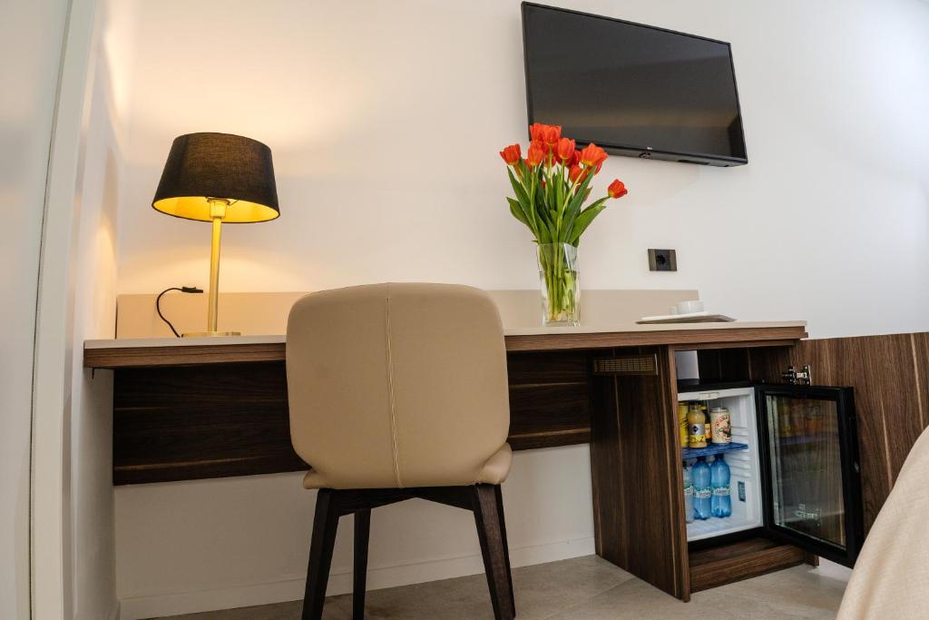 TV a/nebo společenská místnost v ubytování Hotel Falli