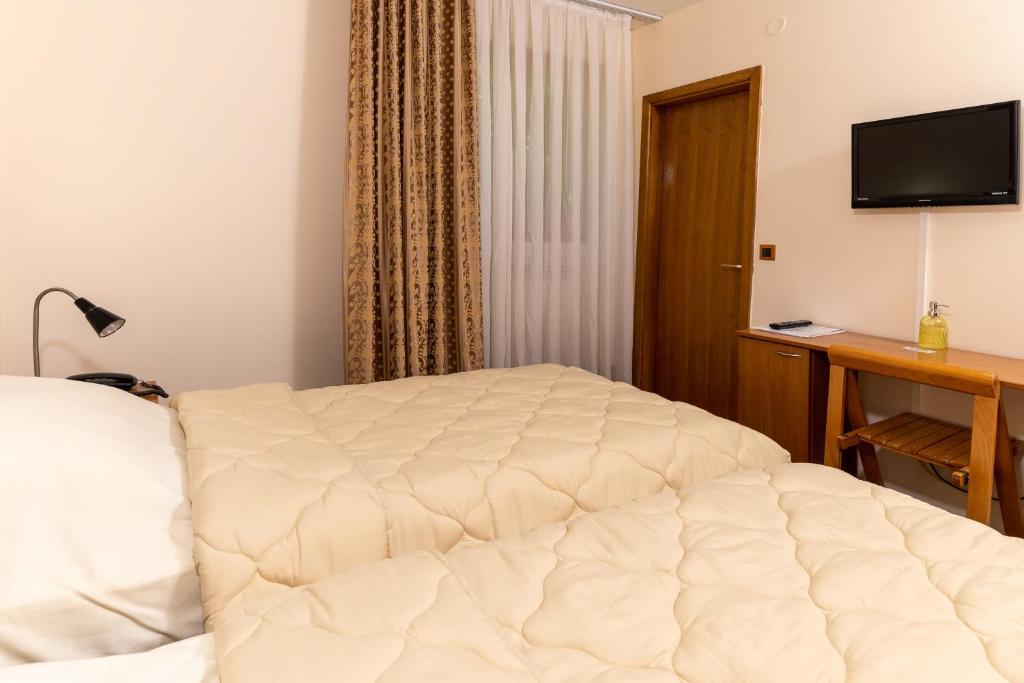 Postel nebo postele na pokoji v ubytování Hotel Kanet