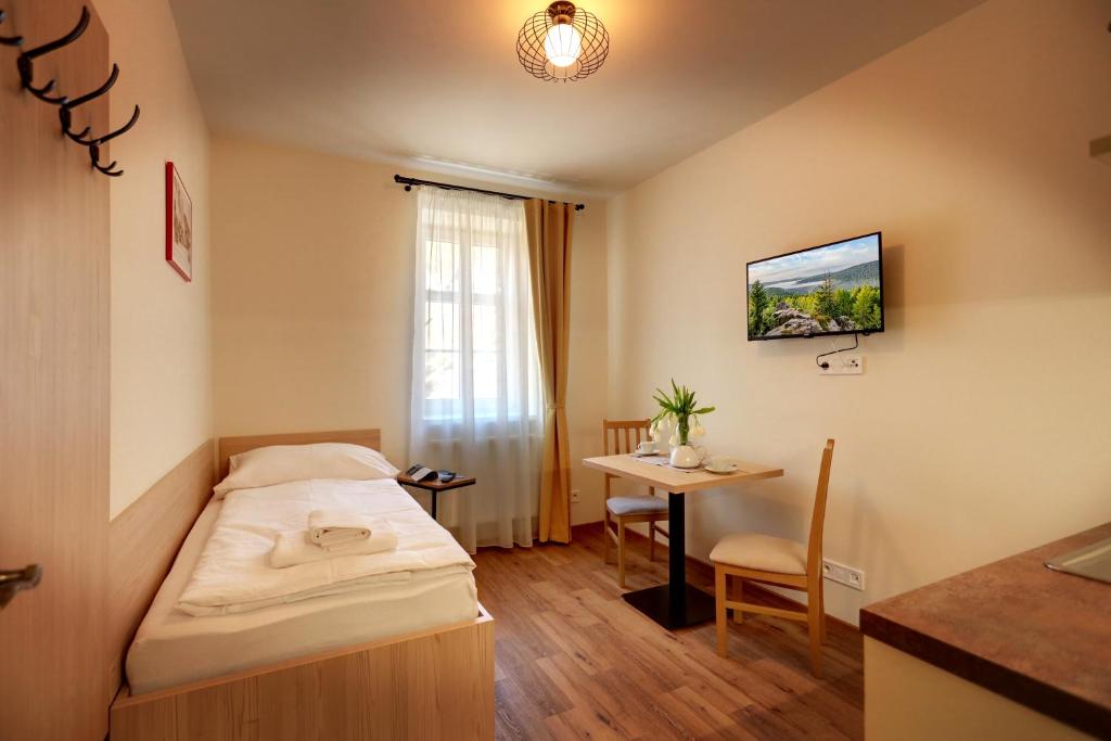 Postel nebo postele na pokoji v ubytování Apartmány Tatra