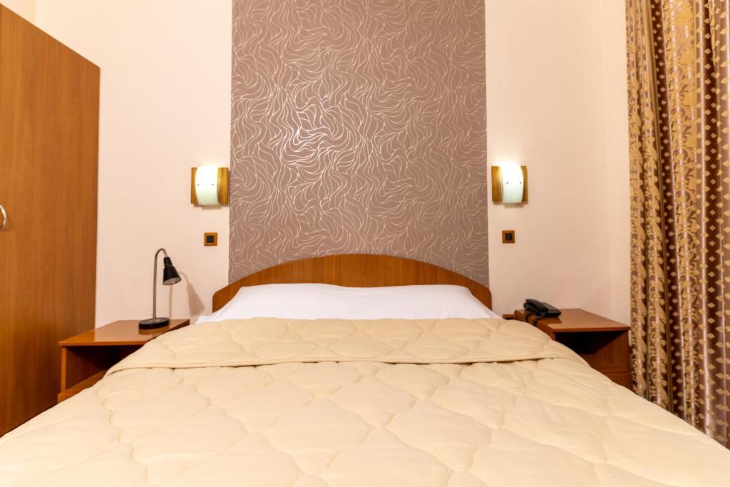 Postel nebo postele na pokoji v ubytování Hotel Kanet
