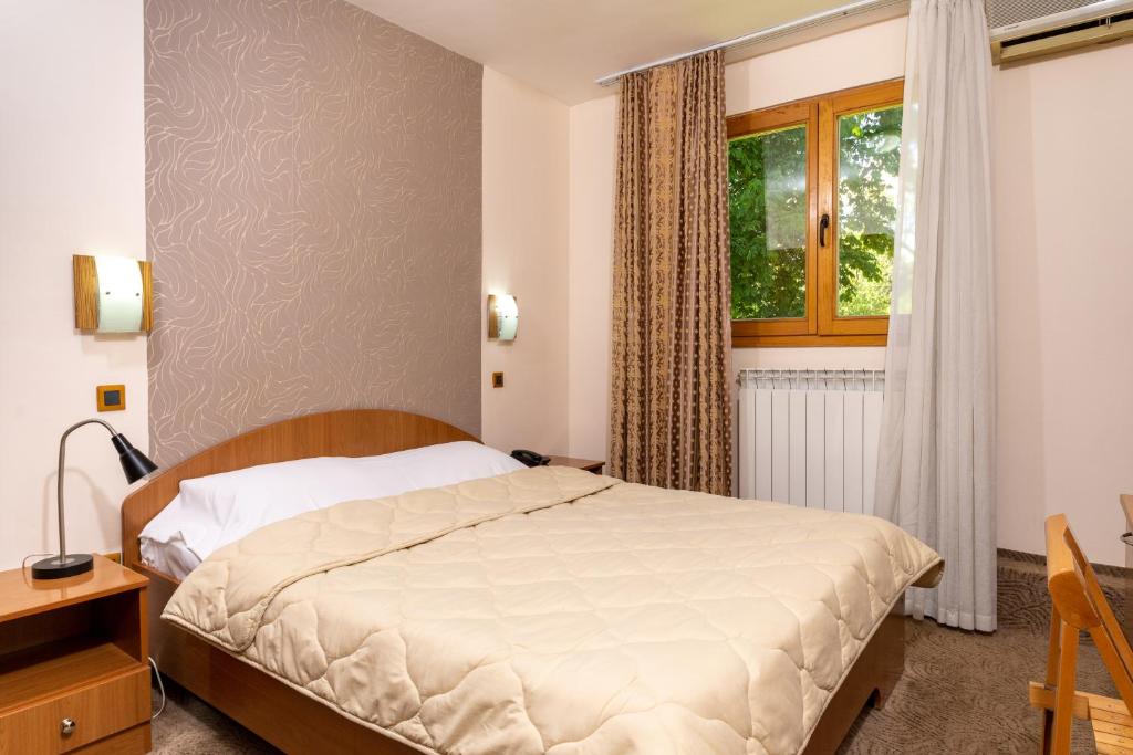 Llit o llits en una habitació de Hotel Kanet