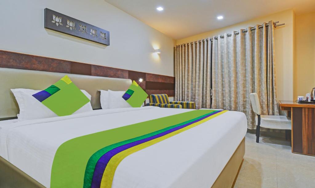 Postel nebo postele na pokoji v ubytování Hotel Mandovin, Udaipur