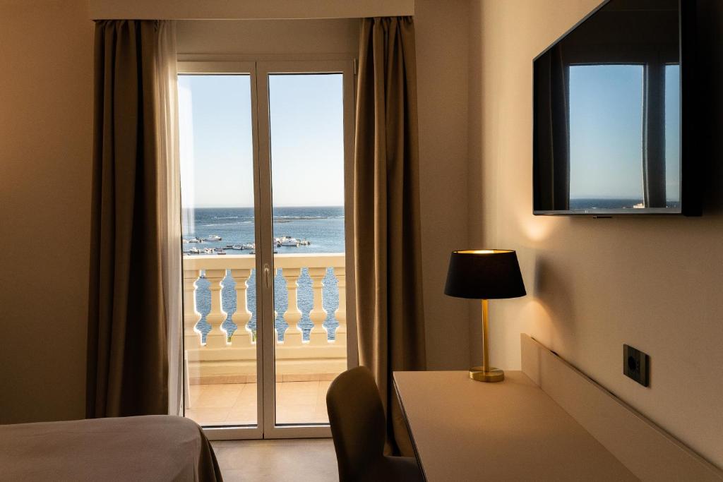 TV a/nebo společenská místnost v ubytování Hotel Falli