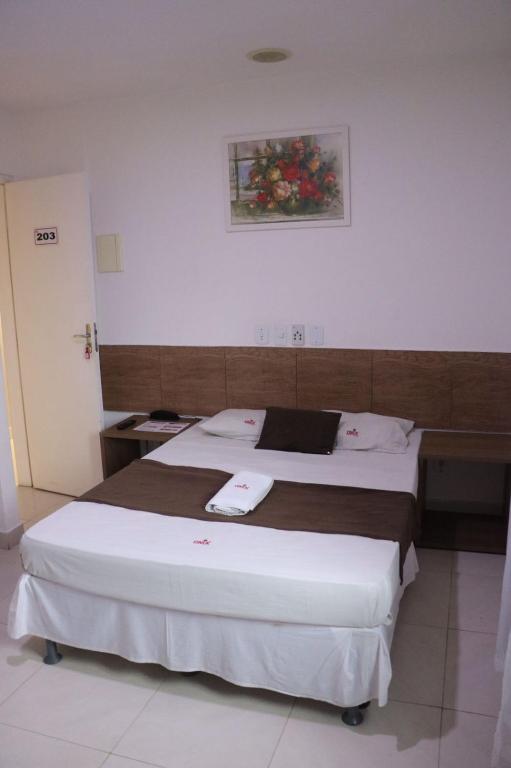 Postel nebo postele na pokoji v ubytování Onix Hotel Praia de Piata