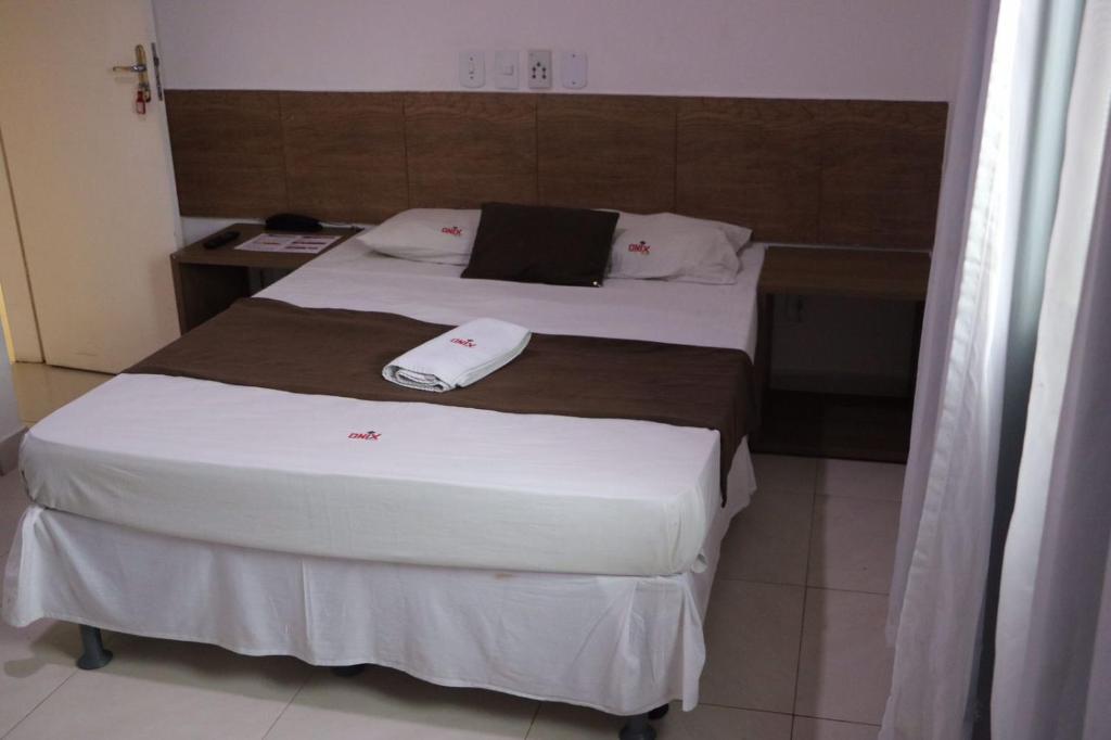 Postel nebo postele na pokoji v ubytování Onix Hotel Praia de Piata