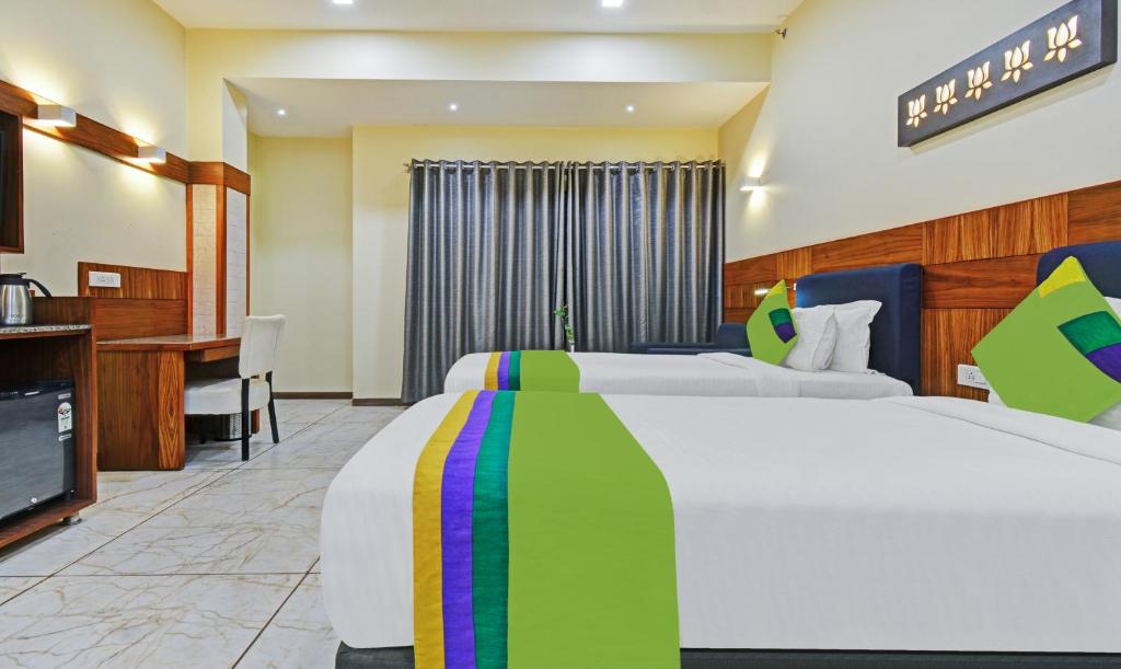 Postel nebo postele na pokoji v ubytování Hotel Mandovin, Udaipur