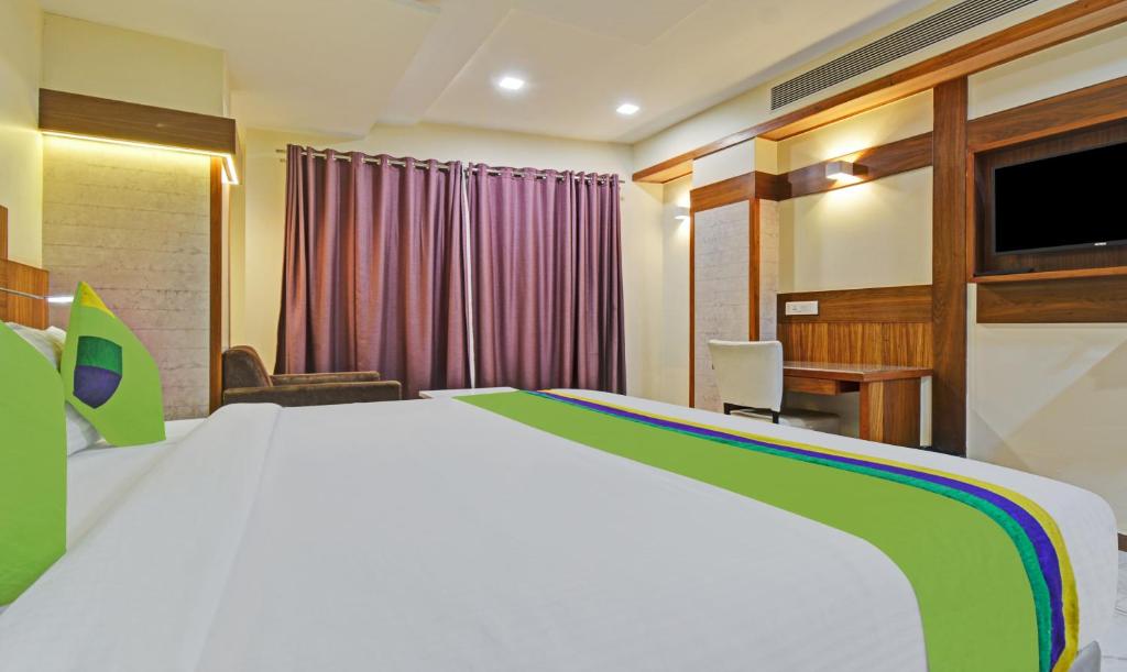 Postel nebo postele na pokoji v ubytování Hotel Mandovin, Udaipur
