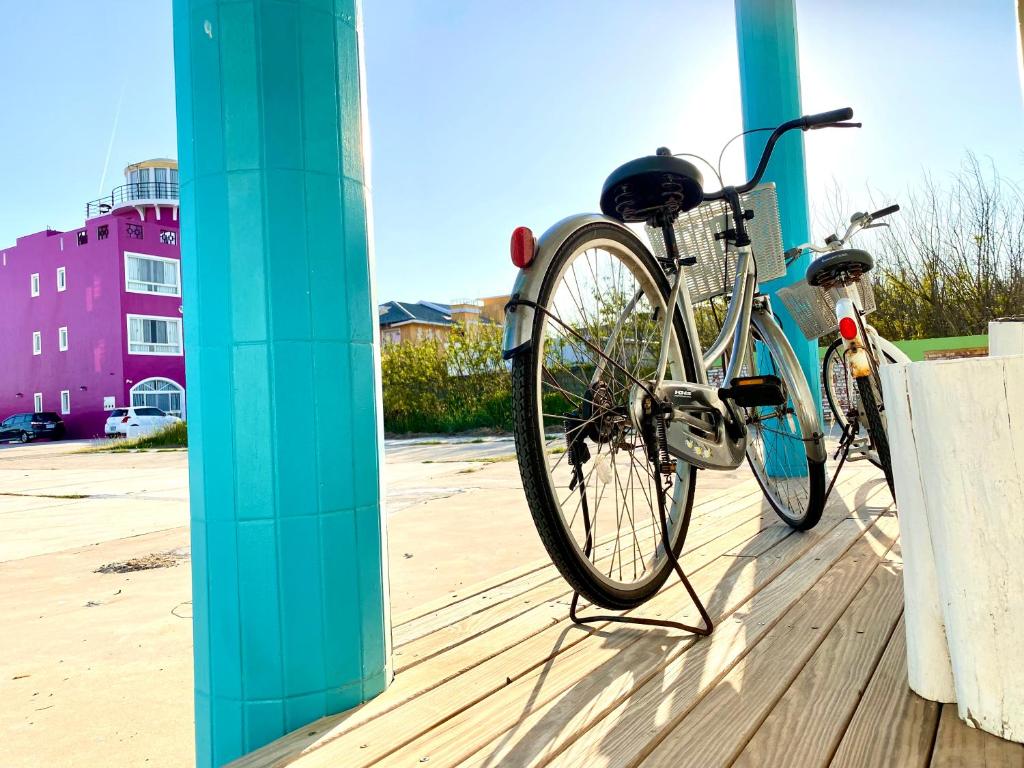 a bike is parked next to a pole at 澎湖北吉光背包客民宿 Bayhouse Hostel Penghu in Magong