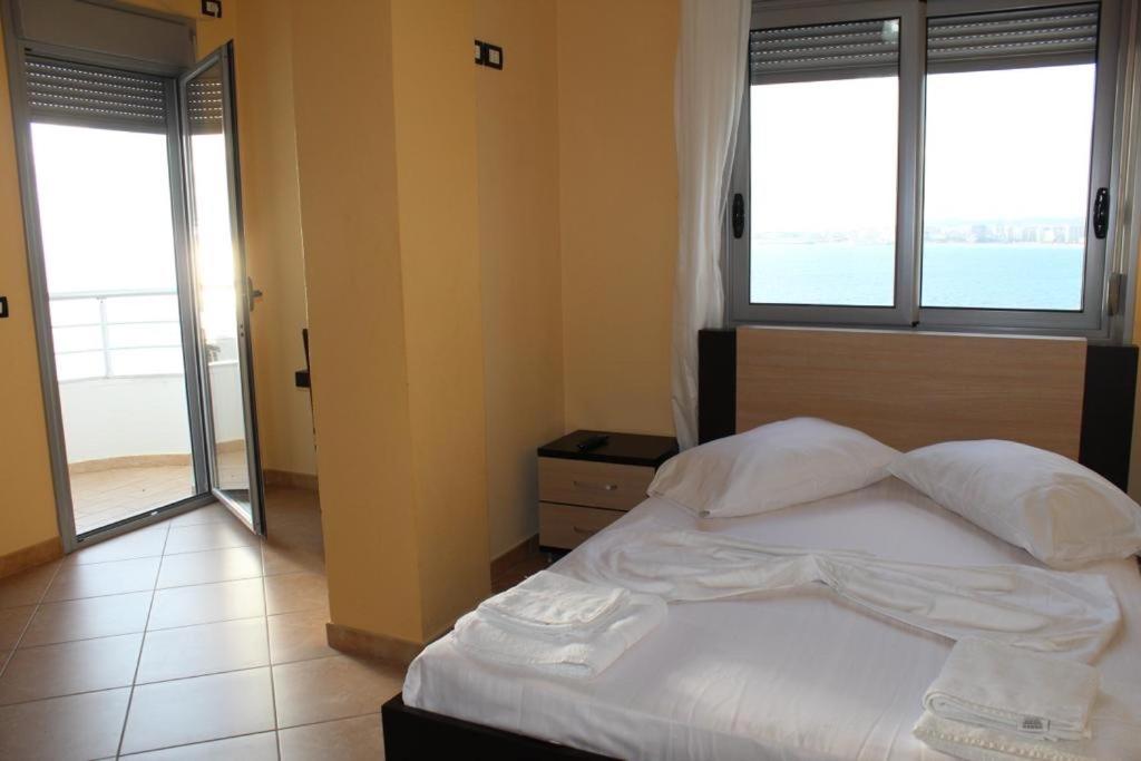 Postel nebo postele na pokoji v ubytování AL Hotel