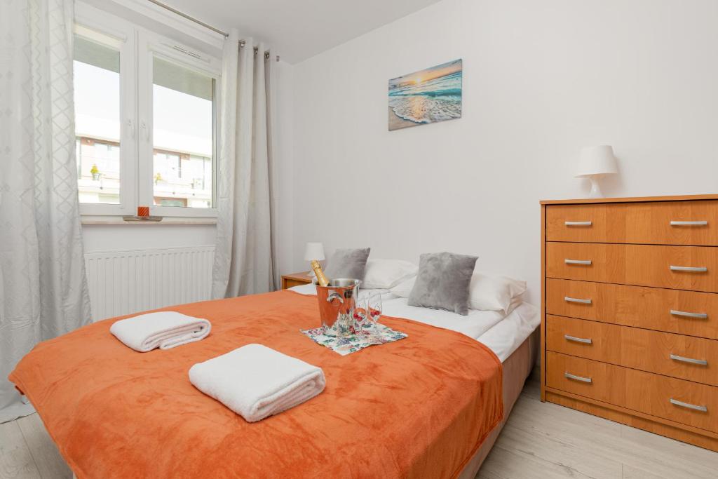 Posteľ alebo postele v izbe v ubytovaní Apartamenty Bursztynowe V by Noclegi Renters