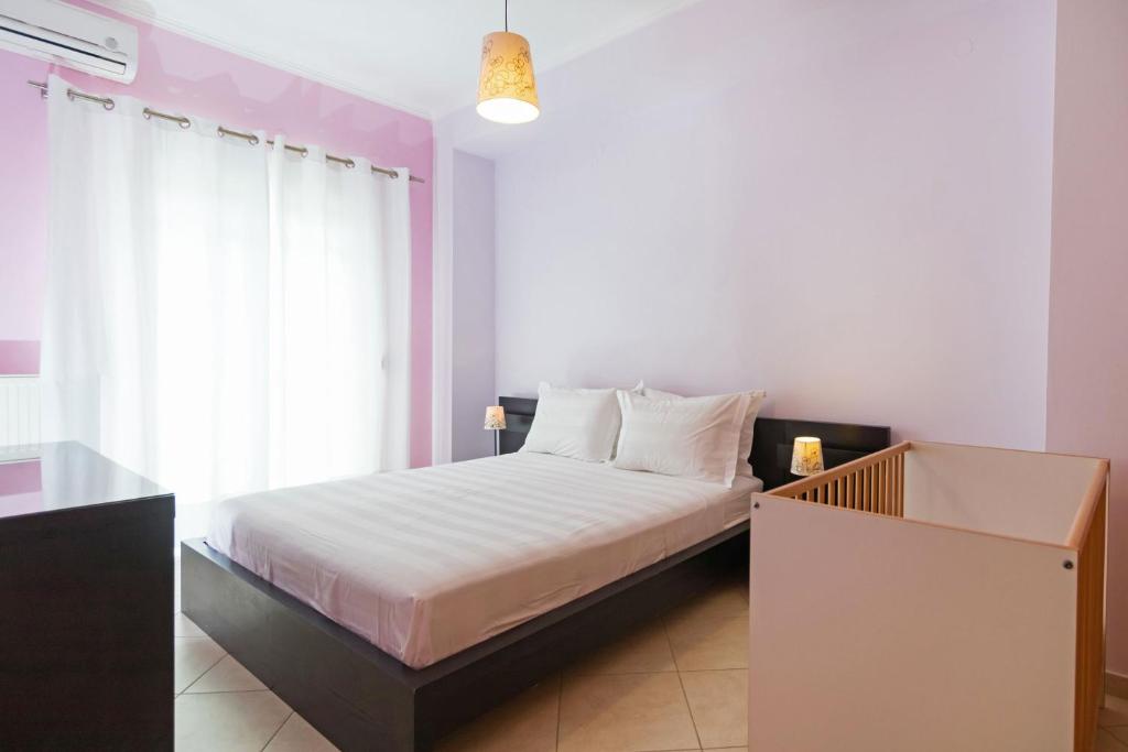 A bed or beds in a room at Aria apts 100 m from the beach by PosarelliVillas
