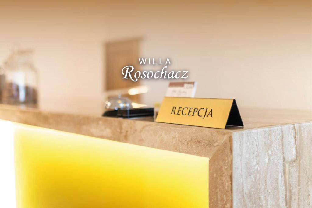 a yellow counter with a sign that reads villa recessions at WILLA ROSOCHACZ Starachowice in Starachowice
