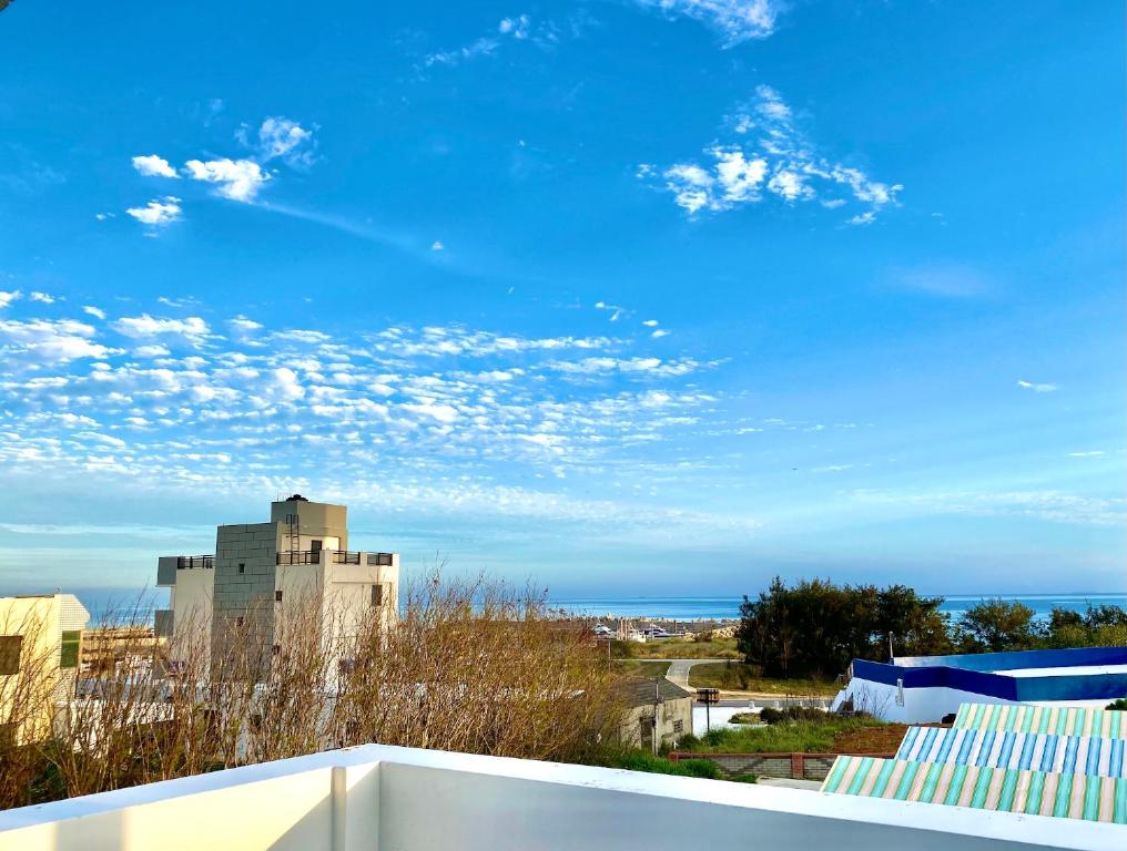 a view of the ocean from the balcony of a building at 澎湖北吉光背包客民宿 Bayhouse Hostel Penghu in Magong