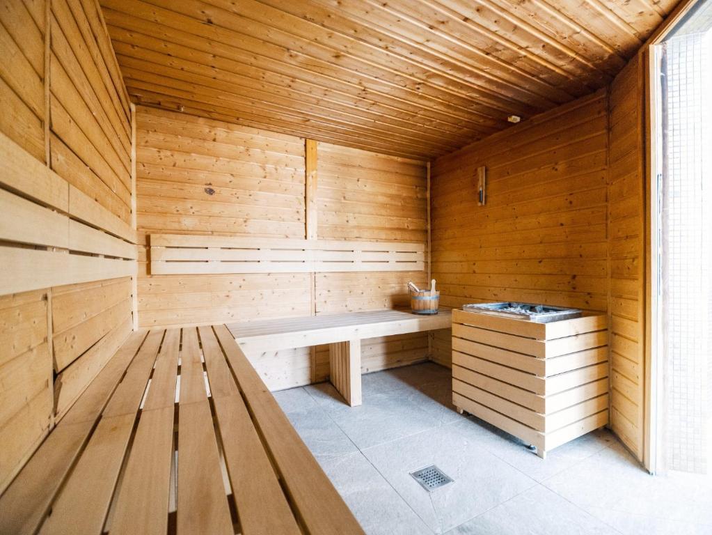 a sauna with a bench in a wooden room at Camping Paradis 4 étoiles A La Corniche La Rochelle Angoulins in Angoulins-sur-Mer