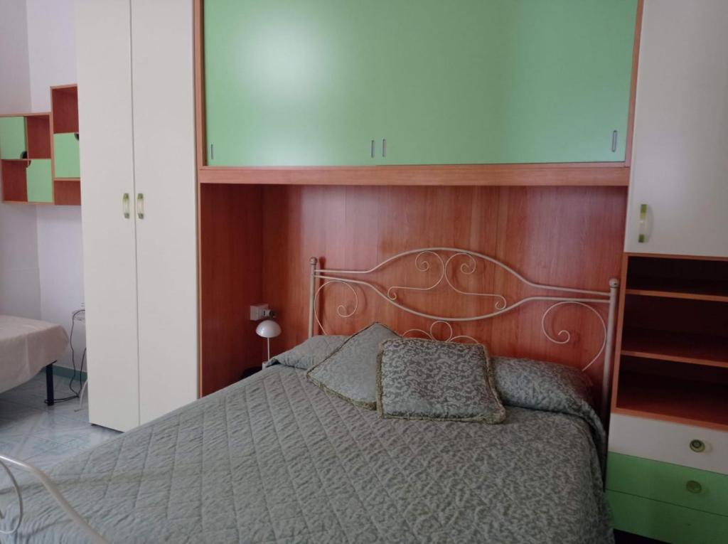 Postel nebo postele na pokoji v ubytování Appartamento Iasolino
