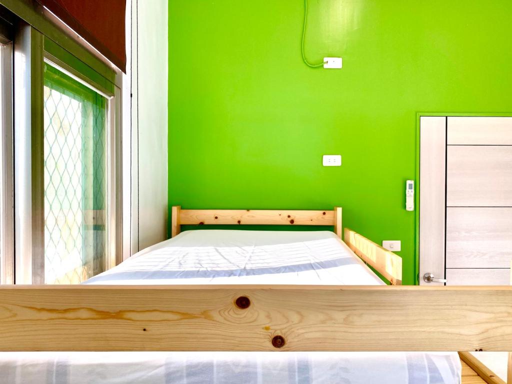 Postel nebo postele na pokoji v ubytování 澎湖北吉光背包客民宿 Bayhouse Hostel Penghu
