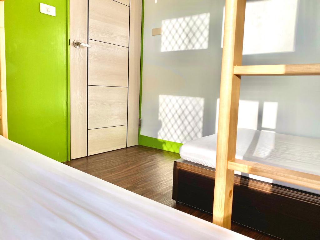 Postel nebo postele na pokoji v ubytování 澎湖北吉光背包客民宿 Bayhouse Hostel Penghu