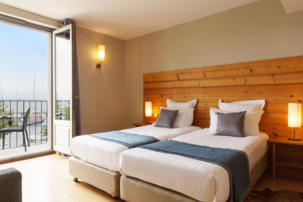 Postel nebo postele na pokoji v ubytování Hôtel La Riviera Victoria