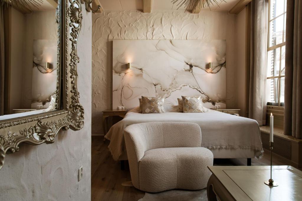 Postel nebo postele na pokoji v ubytování Boutique Hotel Elburg met Tapperij