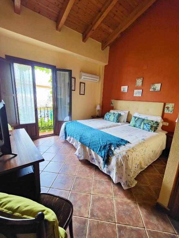 Postel nebo postele na pokoji v ubytování Hotel Doñana Blues