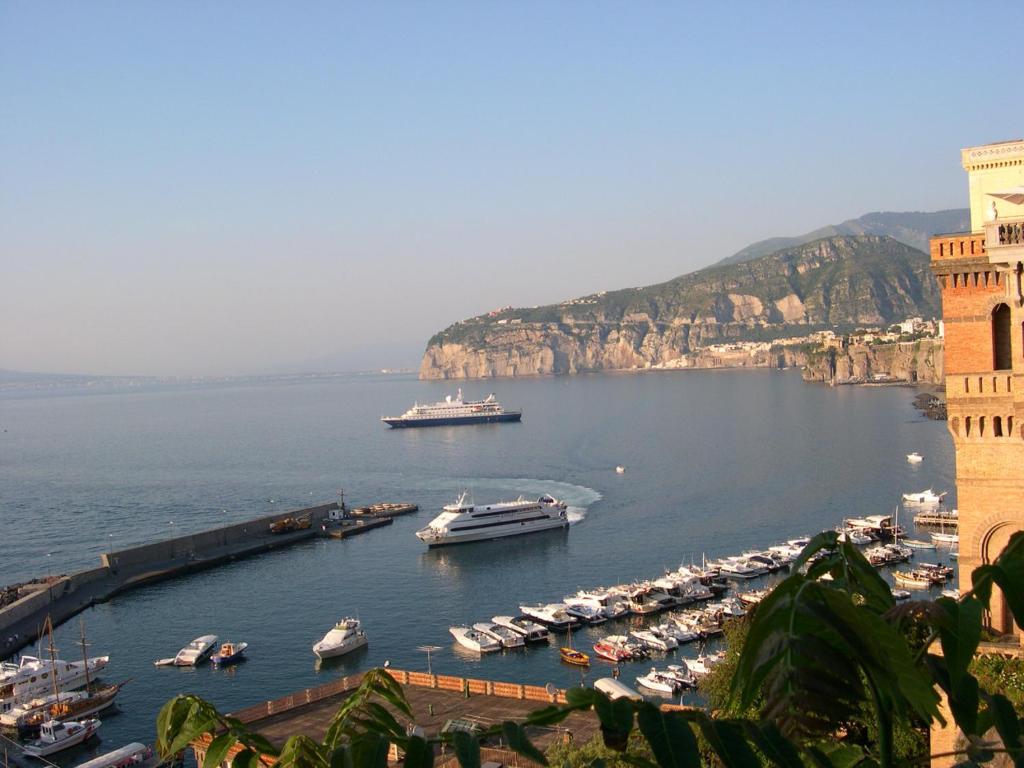 a group of boats docked in a harbor on the water at Terra e Mare in Sorrento