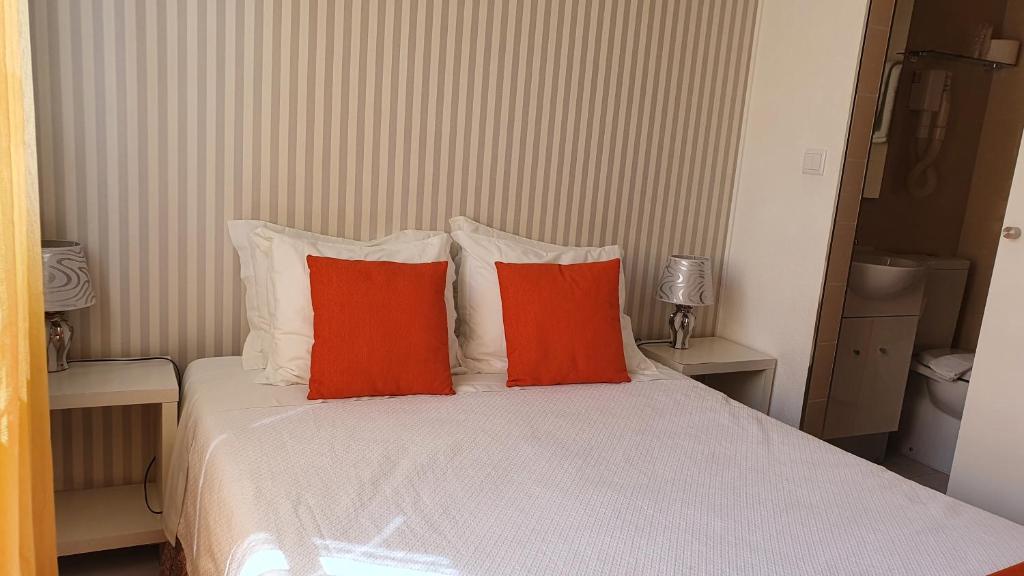 Postel nebo postele na pokoji v ubytování Hotel Palmeira