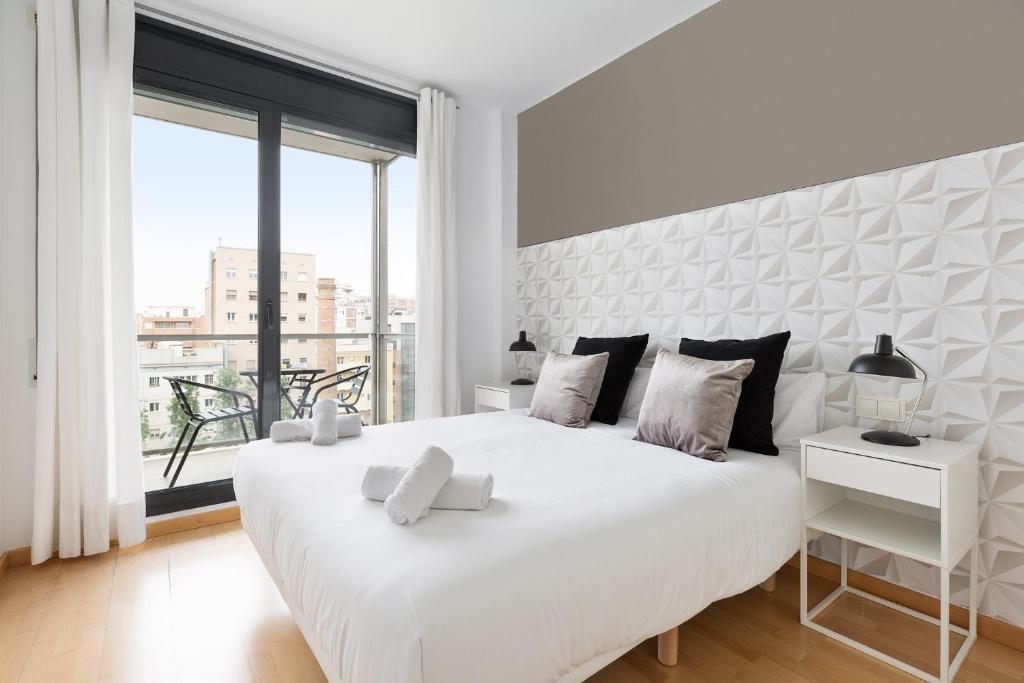 Posteľ alebo postele v izbe v ubytovaní chicStays Apartment Ciutadella Park