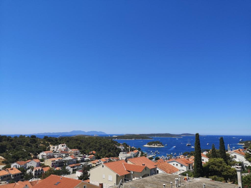 a view of a city and the water at Apartments & Rooms Anita in Hvar