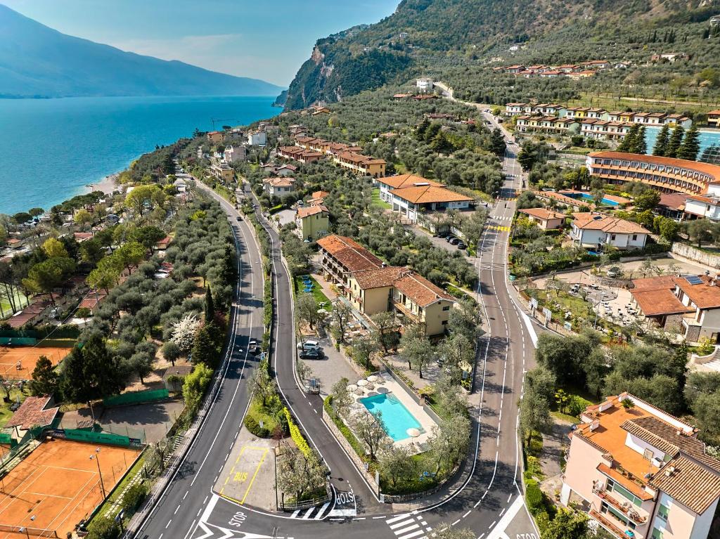 an aerial view of a town next to the water at Hotel Rosemarie in Limone sul Garda