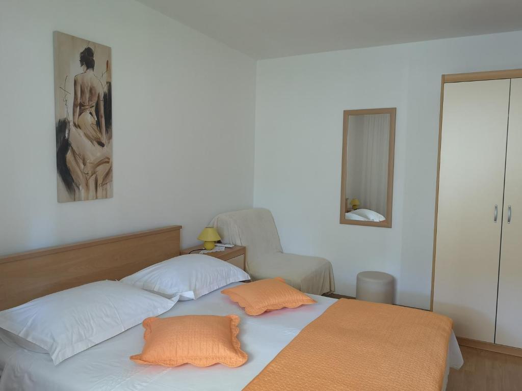 Postel nebo postele na pokoji v ubytování Apartments & Rooms Anita