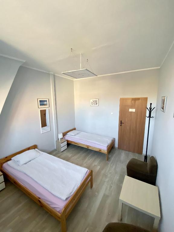 Postel nebo postele na pokoji v ubytování Hostel Universus