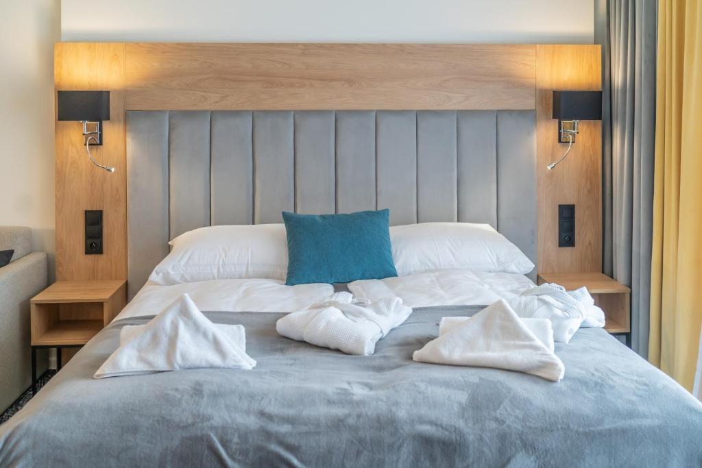 Postel nebo postele na pokoji v ubytování Lux apartmán v hoteli Akvamarín Bešenová