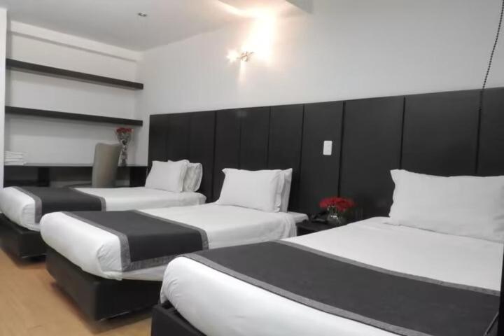 Ein Bett oder Betten in einem Zimmer der Unterkunft Hotel Airport Travel