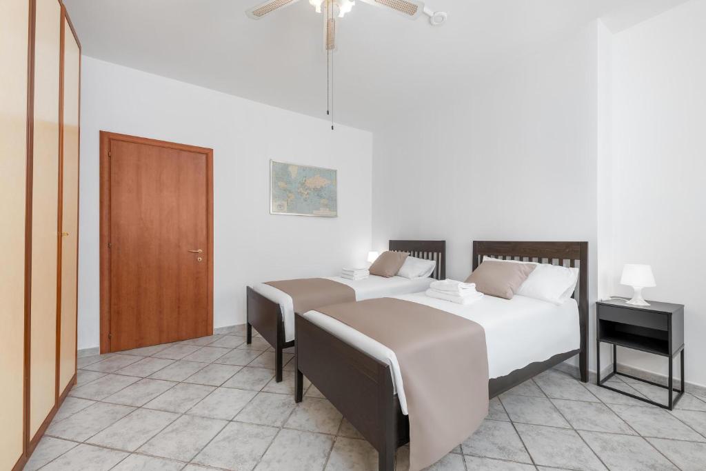 Posteľ alebo postele v izbe v ubytovaní Casa da Suite Evenka