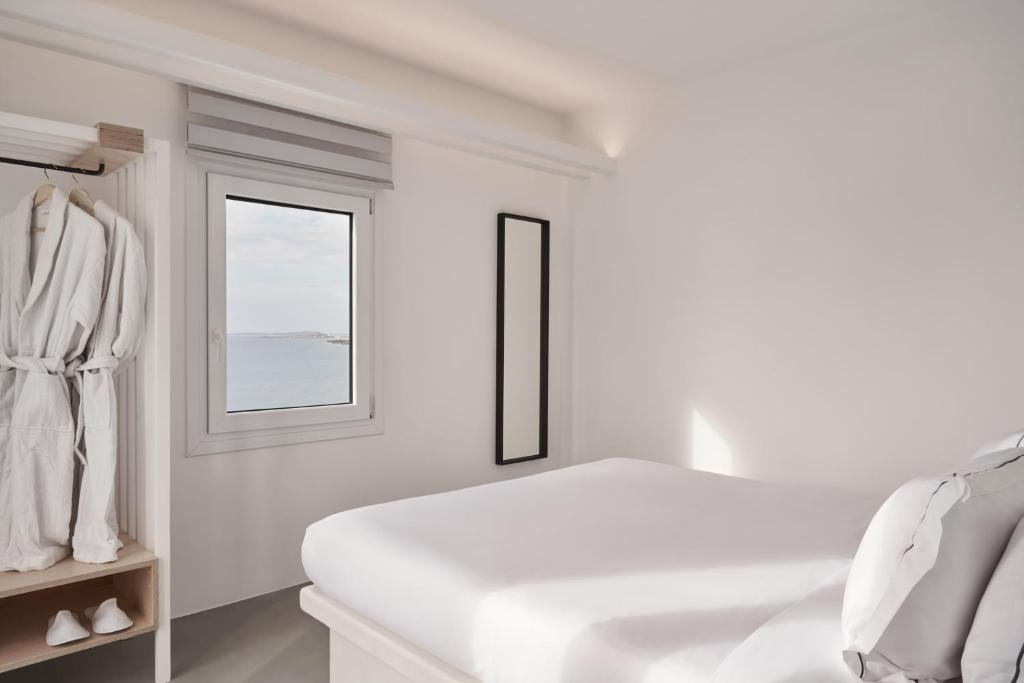 Posteľ alebo postele v izbe v ubytovaní Hill Club Naxos