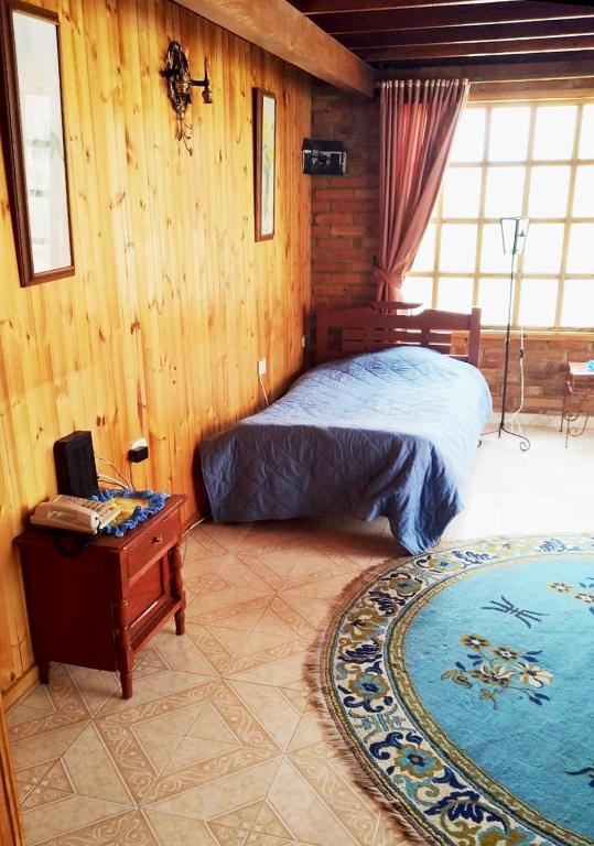 Cama o camas de una habitación en El Peregrino