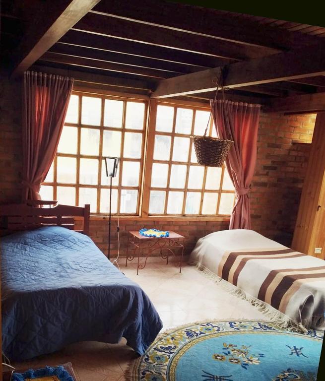 Cama o camas de una habitación en El Peregrino