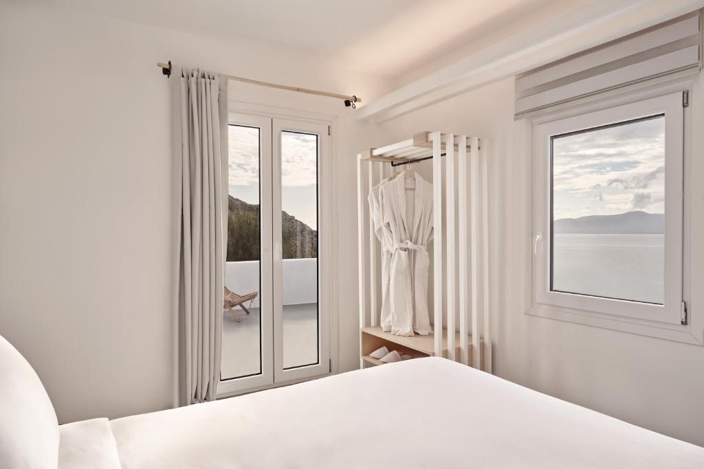 Posteľ alebo postele v izbe v ubytovaní Hill Club Naxos