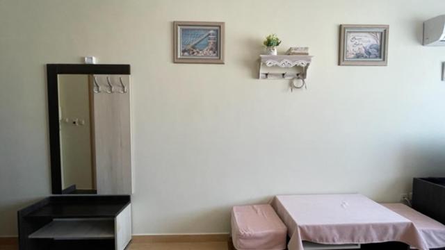 A bed or beds in a room at SUMMER BREEZE 406 Studio Sunny Beach