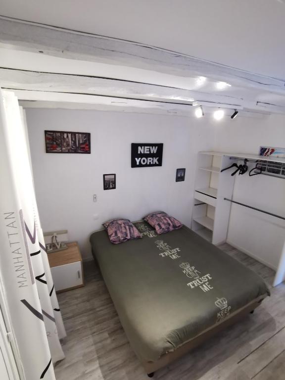 Postel nebo postele na pokoji v ubytování Au Nid de Tillé