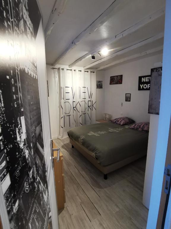 Postel nebo postele na pokoji v ubytování Au Nid de Tillé
