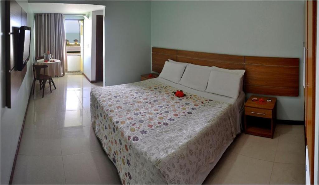 Postel nebo postele na pokoji v ubytování Sunshine Praia Hotel