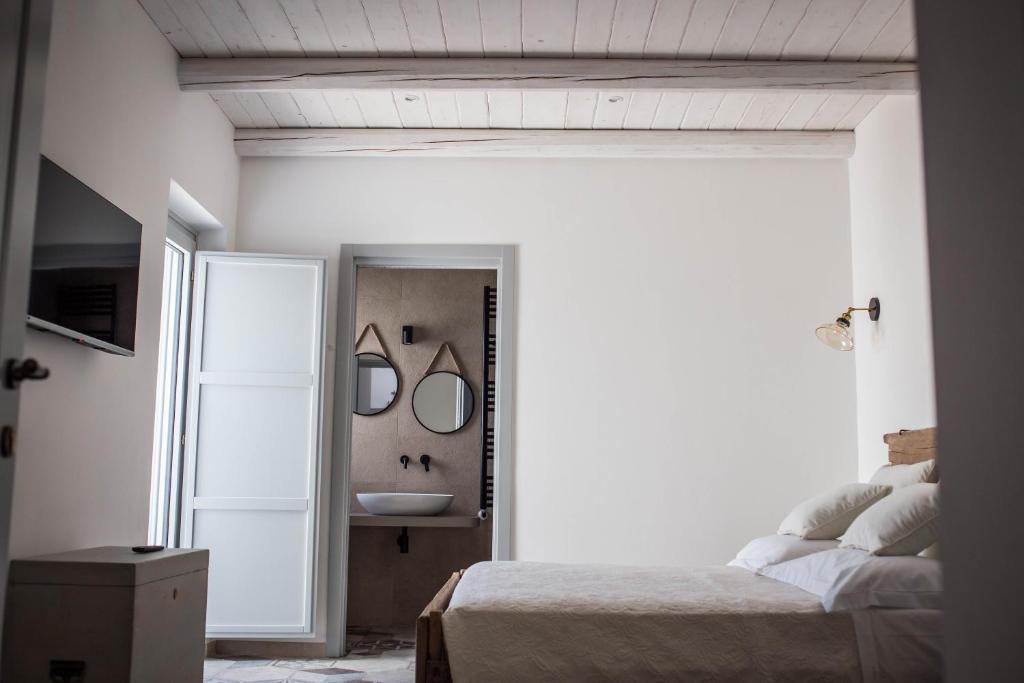 Postel nebo postele na pokoji v ubytování Trullo e Suites Parini 32