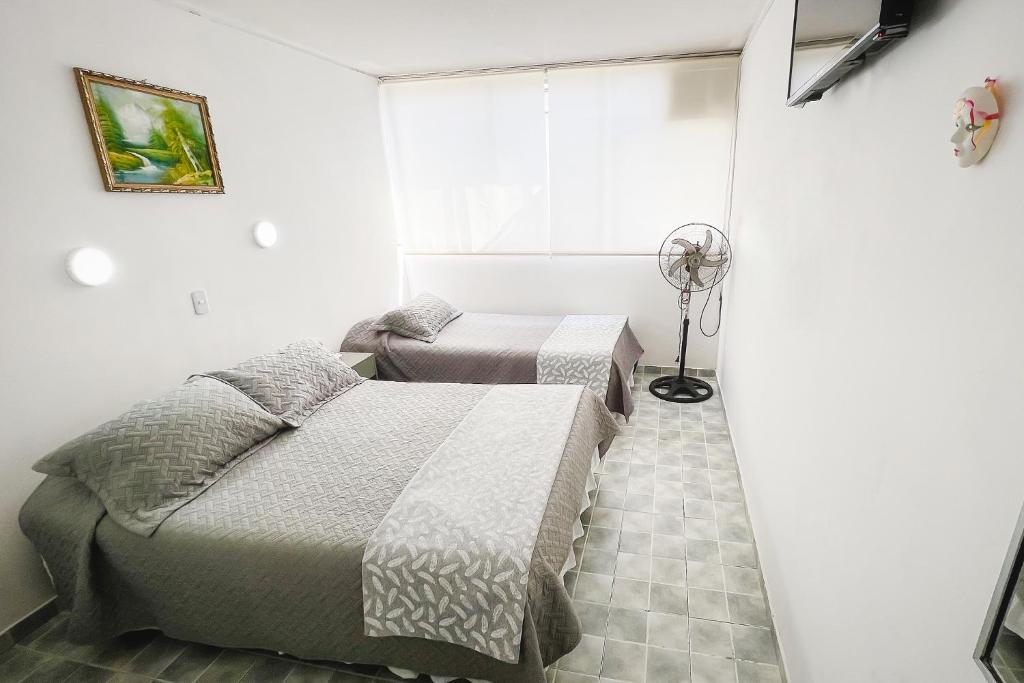 Cama o camas de una habitación en Hotel Concorde