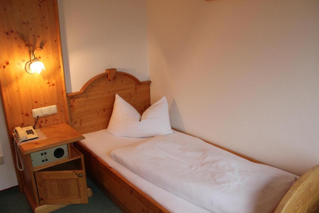 Postel nebo postele na pokoji v ubytování Panorama-Hotel Winklerhof